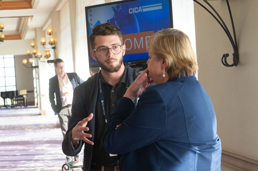 CICA 2022 International Conference Two Attendees Talking