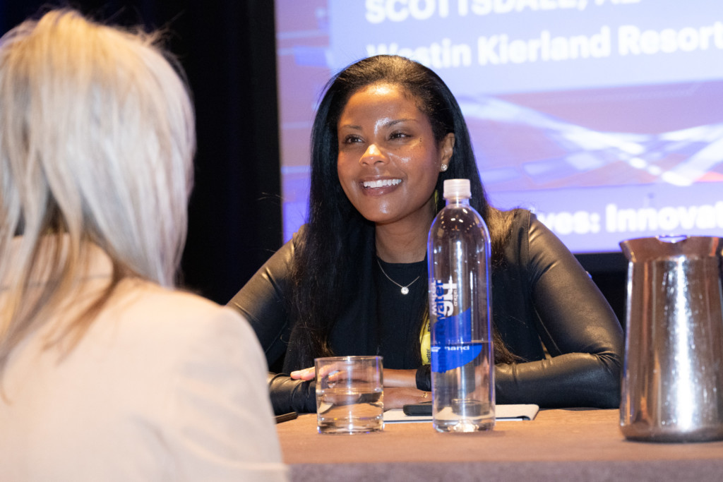 Speaker smiling at an attendee during the CICA 2024 International Conference