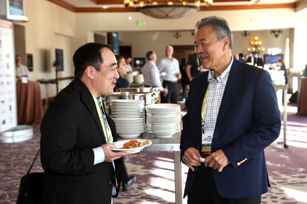 CICA 2025 International Conference attendees smiling and talking at lunch