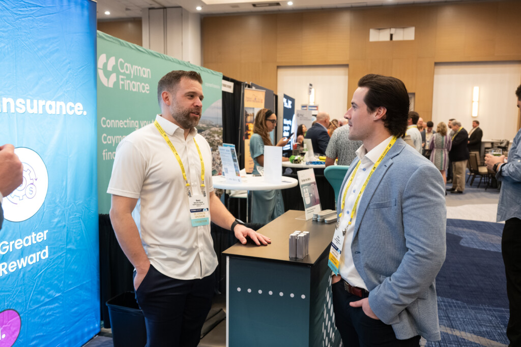 An exhibitor speaks with an attendee in the CICA 2026 International Conference exhibit hall