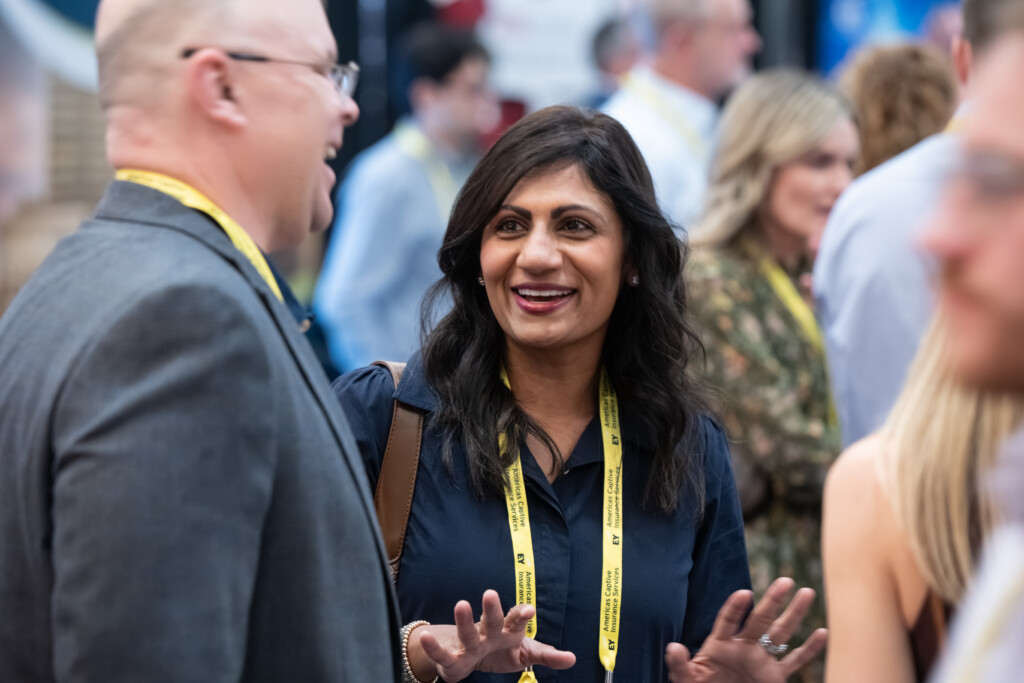 CICA attendees smile and talk during a networking reception at the CICA 2026 International Conference