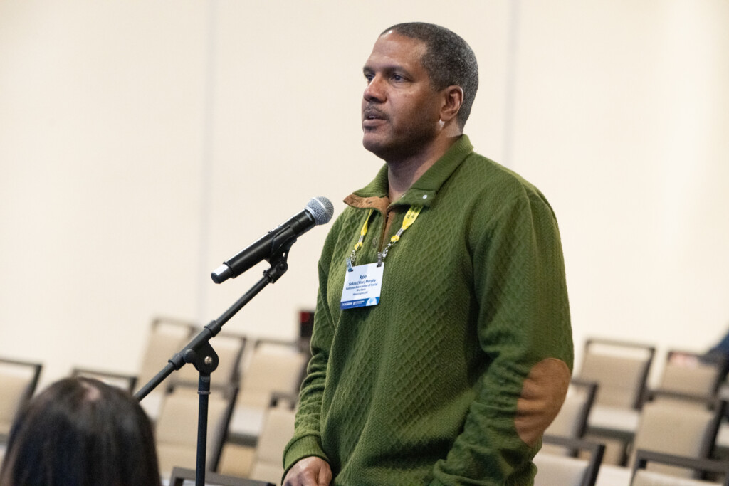 An attendee asks a question at a microphone during an education session at the CICA 2026 International Conference